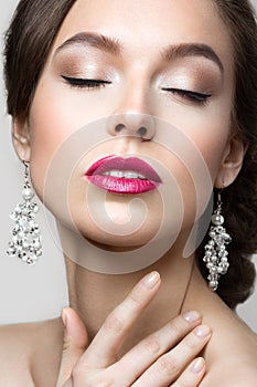 Portrait of a beautiful woman in a wedding dress in the image of the bride.