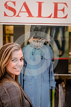 Portrait of beautiful woman window shopping