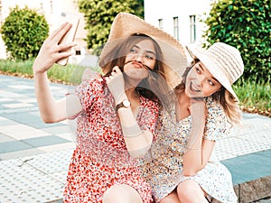 Portrait of beautiful women posing outdoors