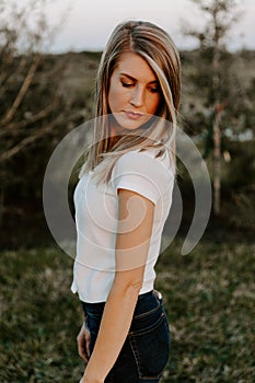 Portrait of Beautiful Young Adult Professional Female Woman Fashion Model Person Smiling Outside at the Park in Nature with Natura