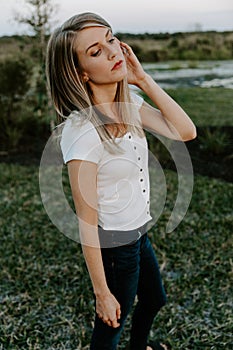 Portrait of Beautiful Young Adult Professional Female Woman Fashion Model Person Smiling Outside at the Park in Nature with Natura