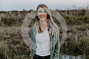 Portrait of Beautiful Young Adult Professional Female Woman Fashion Model Person Smiling Outside at the Park in Nature with Natura