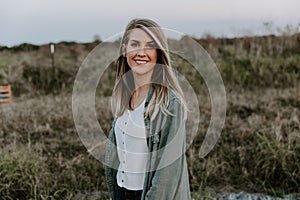 Portrait of Beautiful Young Adult Professional Female Woman Fashion Model Person Smiling Outside at the Park in Nature with Natura