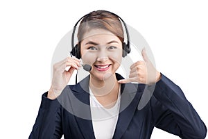 Portrait of beautiful young asian female customer service representative in headset looking at camera and smiling while isolated