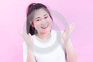 Portrait of beautiful Young Asian woman black hair wear a white t-shirt with open hand. Happy and bright feeling.