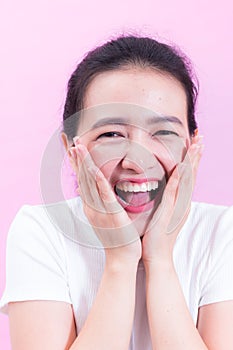 Portrait of beautiful Young Asian woman black hair wear a white t-shirt. with shocked facial expression.