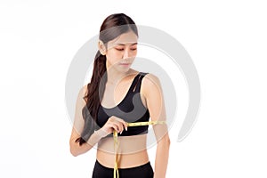 Portrait beautiful young asian woman measure tape with arm for weightloss with satisfied isolated white background.