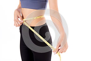 Portrait beautiful young asian woman measure tape with waist for weightloss with satisfied isolated.