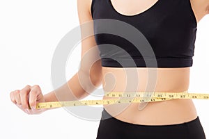 Portrait beautiful young asian woman measure tape with waist for weightloss with satisfied isolated.