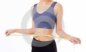 Portrait beautiful young asian woman measure tape with waist for weightloss with satisfied isolated white background.