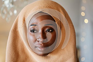 Portrait of beautiful young black african muslim woman wearing headscarf