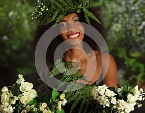 Portrait of a beautiful young black woman on the nature background