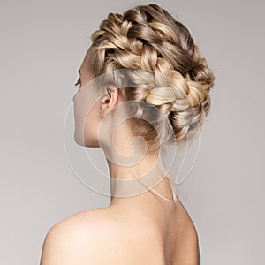 Portrait Of A Beautiful Young Blond Woman With Braid Crown Hairs