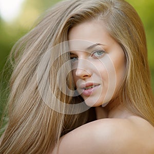 Portrait of beautiful young blond woman with clean face - outdoor