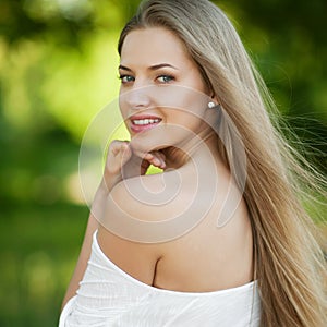 Portrait of beautiful young blond woman with clean face - outdoor