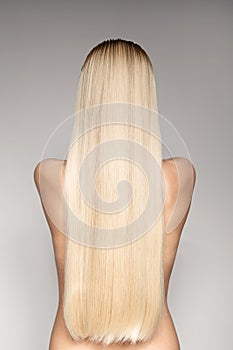 Portrait Of A Beautiful Young Blond Woman With Long Straight Hair