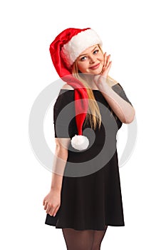 Portrait of a beautiful young blond woman wearing a Santa hat, isolated on white background