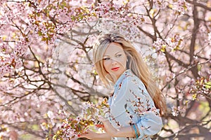 Portrait of a beautiful young blonde woman with long hair in a b