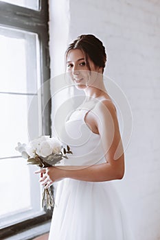 Portrait of beautiful young bride on her wedding day