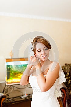 Portrait of a beautiful young bride who wears an earring