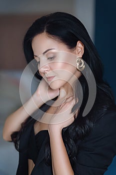 Portrait of beautiful young brunette girl with makeup