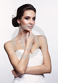 Portrait of beautiful young brunette woman bride in white Wedding Dress