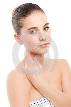 Portrait of beautiful young brunette woman with clean face. Isolated on a white.