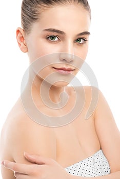 Portrait of beautiful young brunette woman with clean face. Isolated on a white.