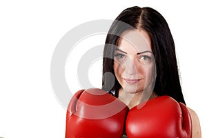 Portrait of a beautiful young brunette woman with red boxing glo