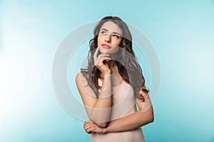 Portrait of a beautiful young brunette woman standing