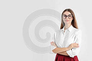 Portrait of beautiful young businesswoman on white background. Space for text