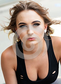 Portrait of Beautiful Young Caucasian Girl with Barbell septum Nose Ring. Horseshoe Nose Ring