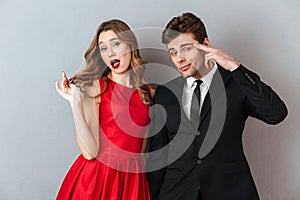 Portrait of a beautiful young couple dressed in formal wear