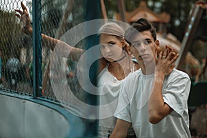 Portrait of a beautiful young couple in love. Teenagers. Man and woman outdoors