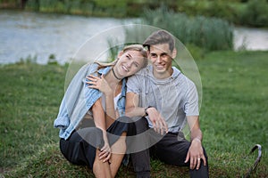 Portrait of a beautiful young couple in love. Teenagers. Man and woman outdoors