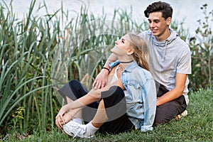 Portrait of a beautiful young couple in love. Teenagers. Man and woman outdoors