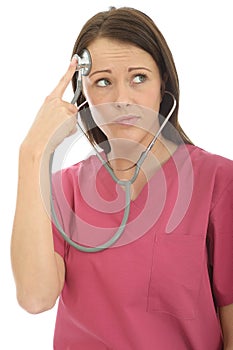 Portrait Of A Beautiful Young Curious Female Doctor Acting Silly with a Stethoscope