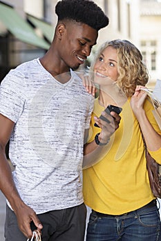 portrait beautiful young diverse tourist couple shopping together