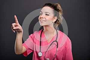 Portrait of beautiful young doctor using touchscreen smiling