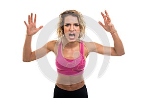 Portrait of beautiful young fit girl screaming out loud