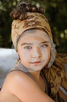 Portrait of a beautiful young girl with head scarf