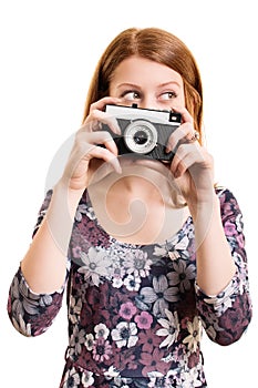 Portrait of a beautiful young girl holding a camera