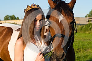 Portrait beautiful young girl with horse