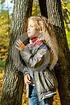 Portrait of beautiful young girl in park