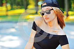 Portrait of a beautiful young girl in sunglasses