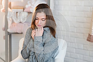 Portrait of a beautiful young girl in a white knit sweater, winter, comfort, warmth, lifestyle, hair, makeup