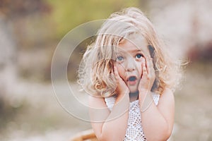 Portrait of a beautiful young happy girl