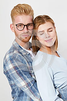 Portrait of a beautiful young happy smiling elegant couple - isolated mock up, background people.B eautiful young happy couple