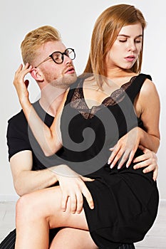 Portrait of a beautiful young happy smiling elegant couple - isolated mock up, background people.B eautiful young happy couple
