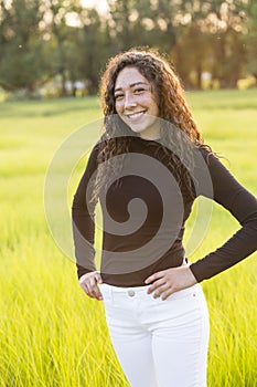 Portrait of a beautiful young hispanic teen girl outdoors